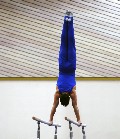 gymnast in control on bars